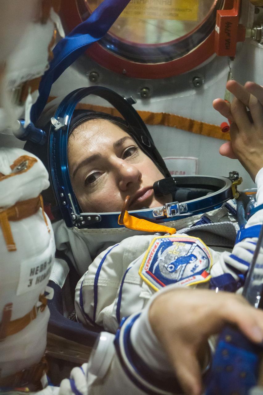 In the Integration Building at the Baikonur Cosmodrome in Kazakhstan, Expedition 61 crewmember Jessica Meir of NASA runs through procedures Sept. 11 aboard the Soyuz MS-15 spacecraft during an initial Soyuz vehicle fit check. Meir, spaceflight participant Hazzaa Ali Almansoori of the United Arab Emirates and Expedition 61 crewmember Oleg Skripochka of Roscosmos will launch Sept. 25 on the Soyuz MS-15 spacecraft from the Baikonur Cosmodrome for a mission on the International Space Station.  NASA/Victor Zelentsov 