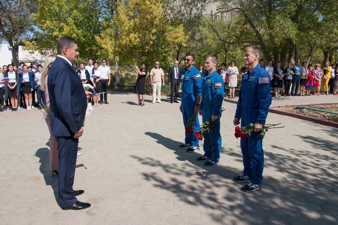 jsc2019e052903 - At their Cosmonaut Hotel crew quarters in Baikonur, Kazakhstan, the backup crewmembers for the next launch to the International Space Station meet with local Kazakh officials Sept. 12 as part of traditional pre-launch activities. On the right are backup spaceflight participant Sultan Al-Neyadi of the United Arab Emirates, Sergey Ryzhikov of Roscosmos and Tom Marshburn of NASA. They are the backups to the prime Expedition 61 crew, Oleg Skripochka of Roscosmos and Jessica Meir of NASA and spaceflight participant Hazzaa Ali Almansoori of the United Arab Emirates, who will launch Sept. 25 on the Soyuz MS-15 spacecraft for a mission on the International Space Station...NASA/Victor Zelentsov.