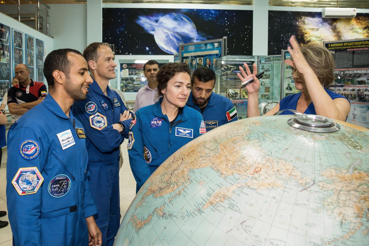 jsc2019e053740 - At the Baikonur Cosmodrome Museum in Kazakhstan, the prime and backup crewmembers for the next launch to the International Space Station receive a briefing Sept. 20 on the flight path of the Soyuz MS-15 rocket during pre-launch activities. From left to right are prime spaceflight participant Hazzaa Ali Almansoori of the United Arab Emirates, backup Expedition 61 crewmember Tom Marshburn of NASA, prime Expedition 61 crewmember Jessica Meir of NASA and backup spaceflight participant Sultan Al-Neyadi of the United Arab Emirates. Meir, Almansoori and Expedition 61 crewmember Oleg Skripochka of Roscosmos will launch Sept. 25 on the Soyuz MS-15 spacecraft for a mission on the International Space Station...NASA/Victor Zelentsov