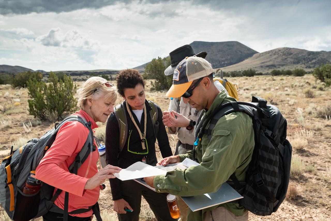 jsc2019e054855 (09-16-19) --- 2017 NASA astronaut candidates Jessica Watkins (center) and Raja Chari (right) with field instructors during geology training in Arizona. Photo Credit: (NASA/Bill Stafford)
