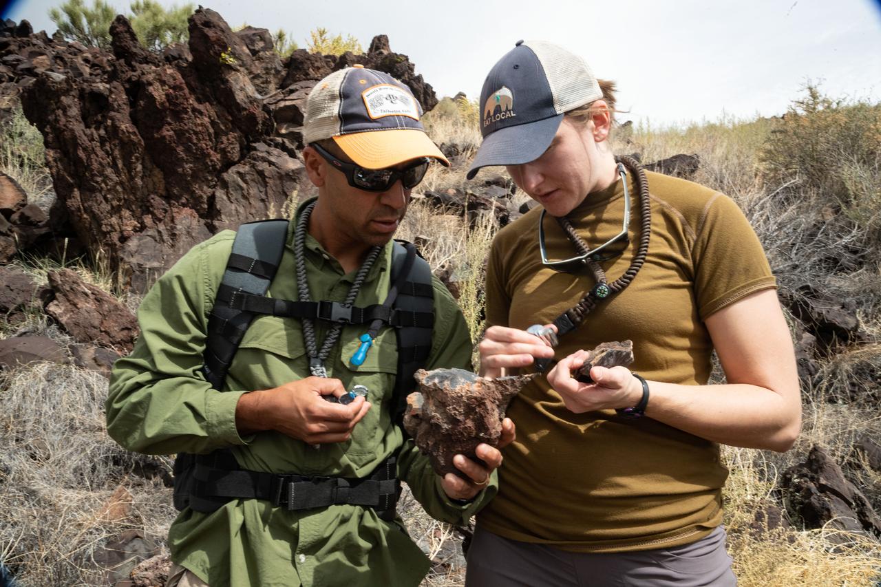 jsc2019e054895 (09-16-19) --- 2017 NASA astronaut candidates Raja Chari and Kayla Barron examines samples during geology training in Arizona. Photo Credit: (NASA/Bill Stafford)