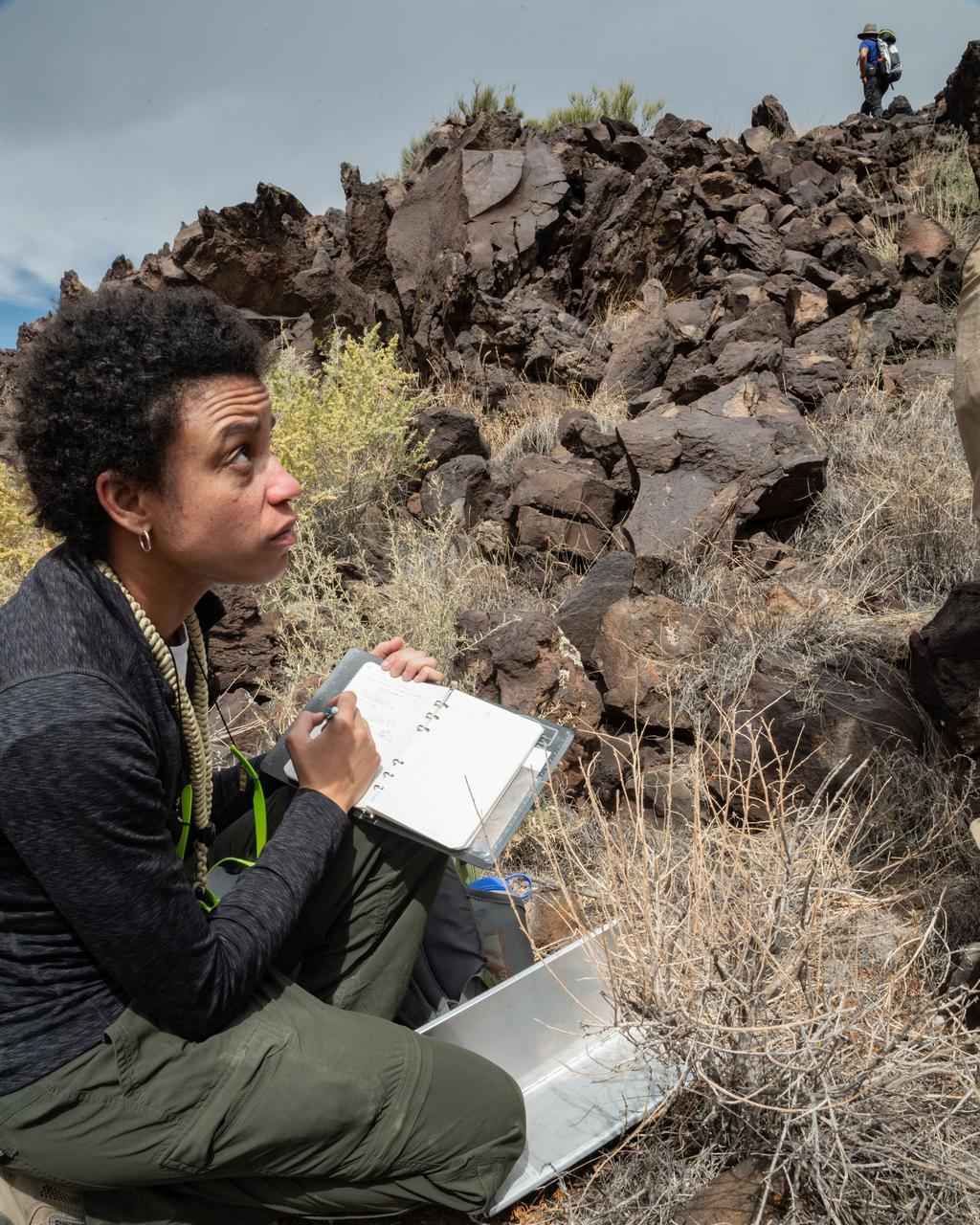 jsc2019e054897 (09-16-19) --- 2017 NASA astronaut candidate Jessica Watkins takes notes during geology training in Arizona. Photo Credit: (NASA/Bill Stafford)