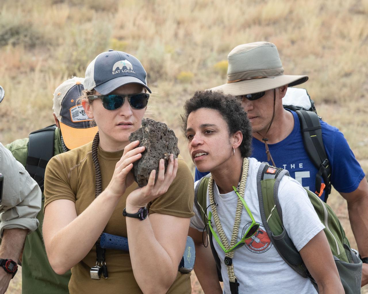 jsc2019e054994(09-16-19) --- 2017 NASA astronaut candidates Kayla Barron (left) and Jessica Watkins (right) examine samples during geology training in Arizona. Photo Credit: (NASA/Bill Stafford)