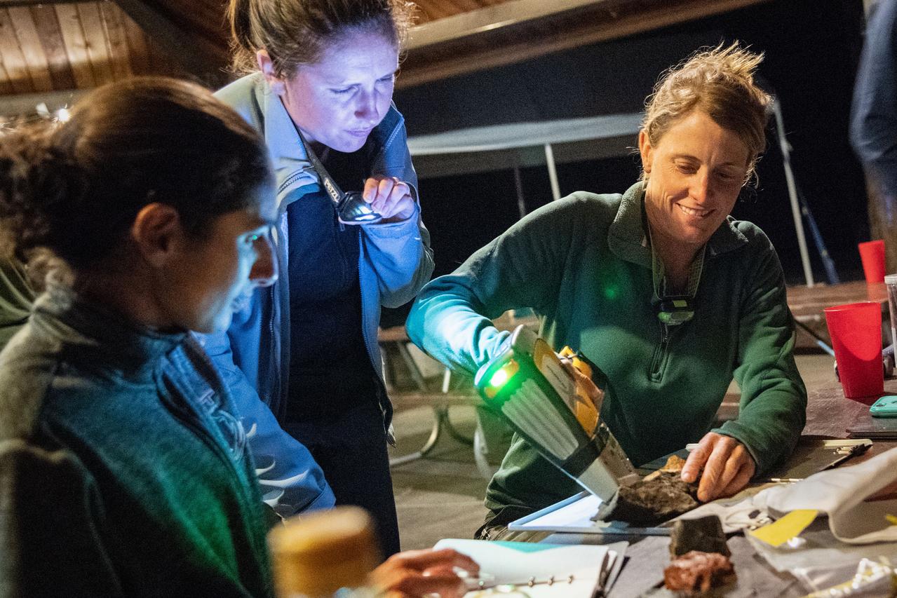 jsc2019e055001 (09-16-19) --- 2017 NASA astronaut candidate Loral O’Hara scans her sample during data collection during geology training in Arizona. Photo Credit: (NASA/Bill Stafford)