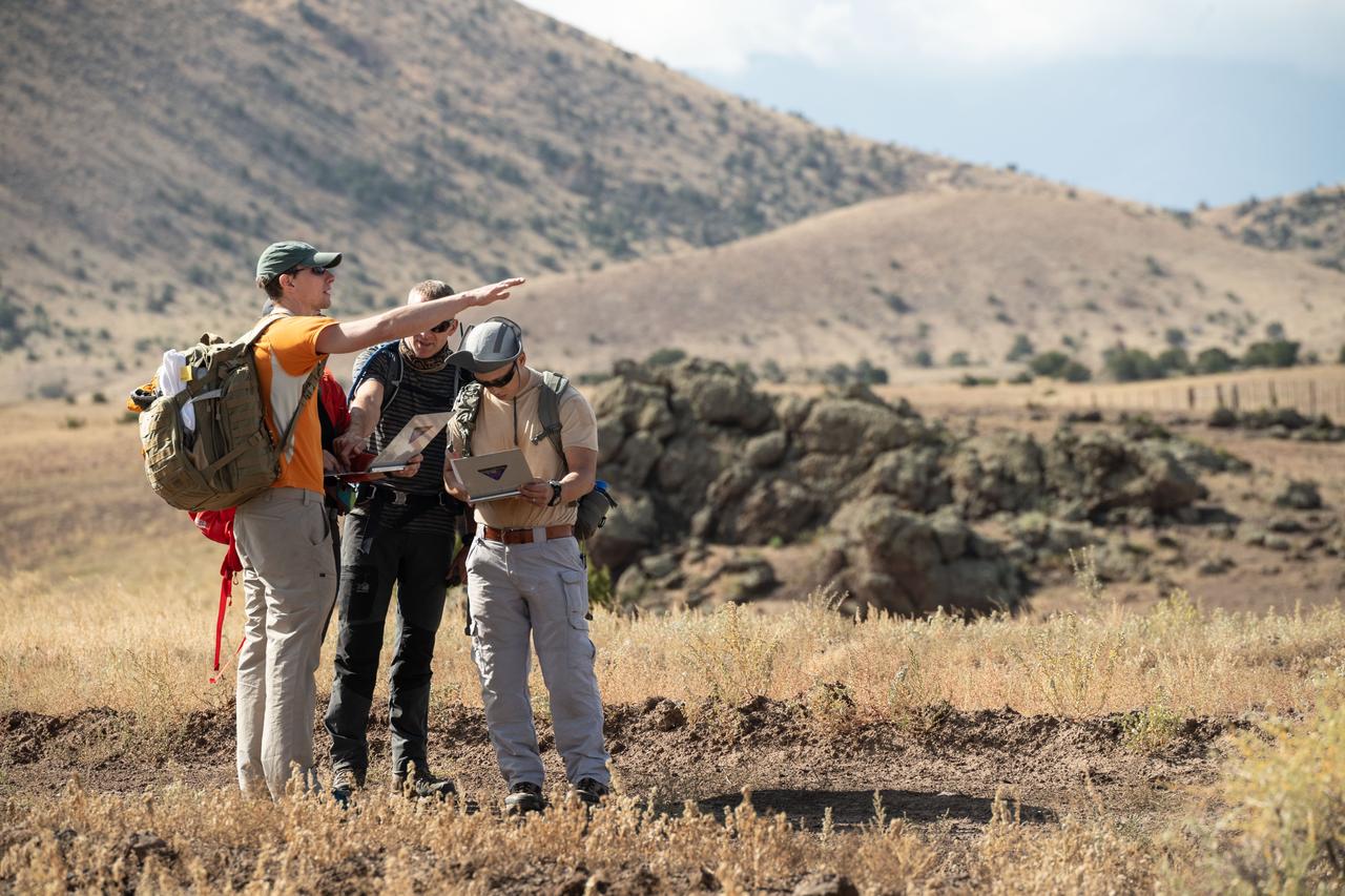 jsc2019e055078 (09-17-19) --- 2017 NASA astronaut candidates Warren Hoburg (left) and Jonny Kim (right) input field data during geology training in Arizona. Photo Credit: (NASA/Bill Stafford)