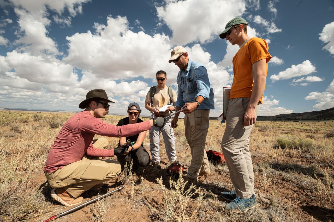 jsc2019e055106 (09-17-19) --- 2017 NASA astronaut candidates gather to review field instrumentation during geology training in Arizona. Photo Credit: (NASA/Bill Stafford)