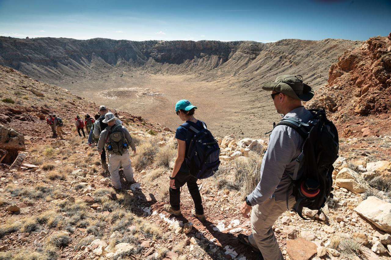 jsc2019e055340 (09-19-19) --- 2017 NASA astronaut candidates hike as a team with their field instructors during geology training in Arizona. Photo Credit: (NASA/Bill Stafford)