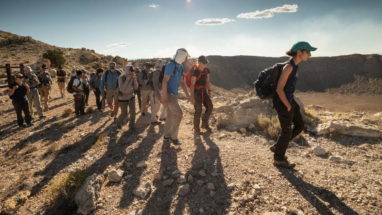 jsc2019e055509 (09-19-19) --- 2017 NASA astronaut candidates hike as a team with their field instructors during geology training in Arizona. Photo Credit: (NASA/Bill Stafford)