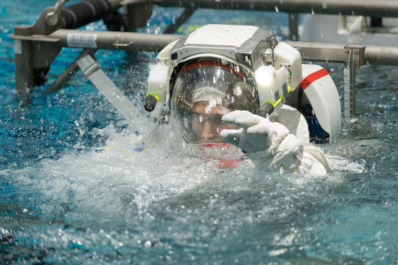 Documentation taken of SpaceX Crew 1 astronauts Mike Hopkins and Victor Glover during ISS EVA MAINT 8 training at NBL pool topside. 