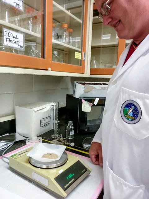 jsc2019e062135 (10/24/2019) --- Dr. Karl Shiller weighs some of the material included with the nematodes tubes. Microgravity Effect on Entomopathogenic Nematodes’ Ability to Find and Kill Insects (Module-85 Pheronym) tests the effects of microgravity on the movement and infection behavior of beneficial nematodes, which are used to control agricultural insect pests. The research looks at whether these nematodes can navigate through soil, infect insects and reproduce in space. It also looks at whether their symbiotic bacteria function normally in microgravity and has any effects on insect host physiology. Image Courtesy of: Fatma Kaplan (PI)