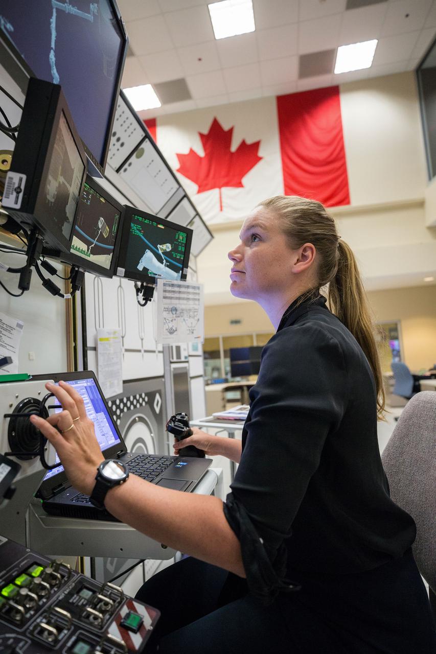 jsc2019e062856 (10-10-19) --- Canadian Space Agency (CSA) astronaut Jennifer Sidey-Gibbons participates in Canadarm2 robotics training at CSA headquarters in Saint-Hubert, Quebec. Photo Credit: (Canadian Space Agency)