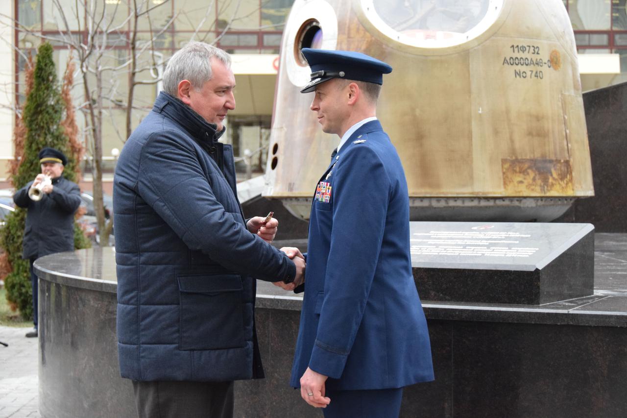 jsc2019e067107 - Outside the headquarters of the Russian space agency Roscosmos in Moscow, NASA astronaut Nick Hague (right) receives the medal of the Order of Courage from the head of Roscosmos, Dmitri Rogozin Dec. 2. The awarding of the medal to Hague accompanied the unveiling of the Soyuz spacecraft in front of Roscosmos’ headquarters building in which Hague and crewmate and Russian cosmonaut Alexey Ovchinin launched on Oct. 11, 2018 on an aborted mission to the International Space Station. About two minutes after launch, a booster separation problem triggered a launch abort, resulting in Hague and Ovchinin flying free of their Soyuz booster and landing safely in their Soyuz capsule downrange on the steppe of Kazakhstan. Hague and Ovchinin were reassigned to fly again, launching on March 15, 2019 for a mission that spanned 203 days in space...Credit: Roscosmos                .