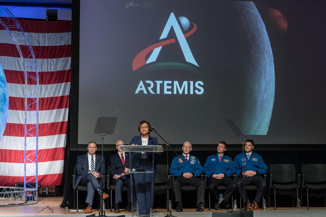 jsc2020e000599 (Jan. 10, 2020) --- Johnson Space Center Deputy Director Vanessa Wyche addresses visitors attending the graduation of the 2017 Class of Astronauts at the Johnson Space Center in Houston, Texas. In the back row (from left) are NASA Administrator Jim Bridenstine, Johnson Space Center Director Mark Geyer, Chief of the Astronuat Office Patrick Forrester, NASA astronaut Reid Wiseman and Canadian Space Agency (CSA) astronaut Jeremy Hansen.  This is the first class of astronauts to graduate under the Artemis program and are now eligible for assignments to the International Space Station, Artemis missions to the Moon, and ultimately, missions to Mars.