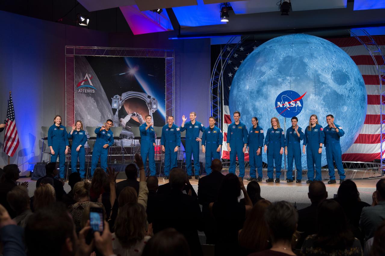 jsc2020e000607 (Jan. 10, 2020) --- The 2017 Class of Astronauts participate in graduation ceremonies at the Johnson Space Center in Houston, Texas. From left are, NASA astronauts Kayla Barron, Zena Cardman, Raja Chari, Matthew Dominick, Bob Hines, Warren Hoburg, Jonny Kim, Canadian Space Agency (CSA) astronaut Joshua Kutryk, NASA astronauts Jasmin Moghbeli, Loral O'Hara and Jessica Watkins, CSA astronaut Jennifer Sidey-Gibbon and NASA astronaut Frank Rubio.  This is the first class of astronauts to graduate under the Artemis program and are now eligible for assignments to the International Space Station, Artemis missions to the Moon, and ultimately, missions to Mars.