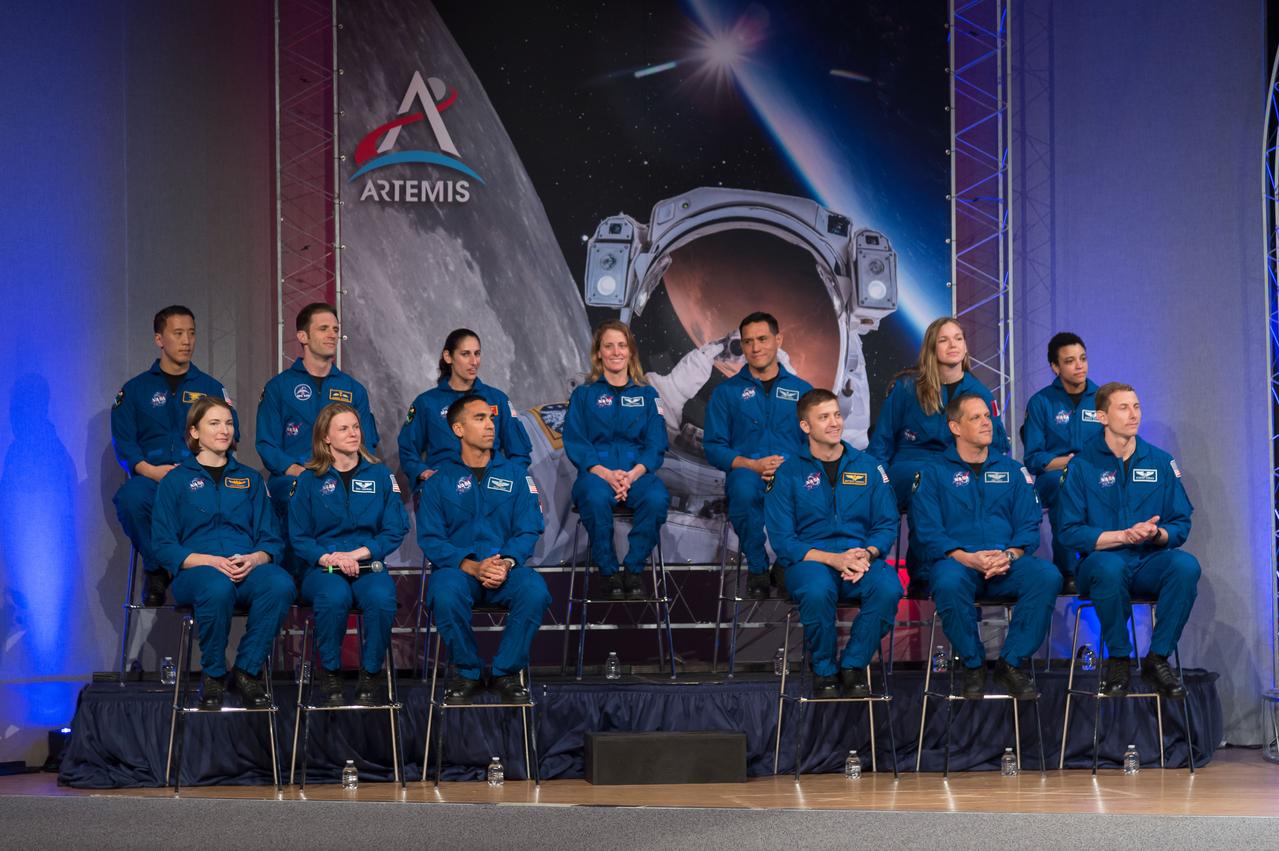 jsc2020e000609 (Jan. 10, 2020) --- The 2017 Class of Astronauts participate in graduation ceremonies at the Johnson Space Center in Houston, Texas. In the front row (from left) are, NASA astronauts Kayla Barron, Zena Cardman, Raja Chari, Matthew Dominick, Bob Hines and Warren Hoburg. In the back row (from left) are, NASA astronaut Jonny Kim, Canadian Space Agency (CSA) astronaut Joshua Kutryk, NASA astronauts Jasmin Moghbeli, Loral O'Hara and Frank Rubio, CSA astronaut Jennifer Sidey-Gibbon and NASA astronaut Jessica Watkins.  This is the first class of astronauts to graduate under the Artemis program and are now eligible for assignments to the International Space Station, Artemis missions to the Moon, and ultimately, missions to Mars.