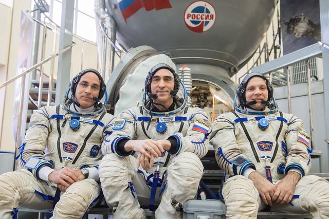 jsc2020e016220 - At the Gagarin Cosmonaut Training Center in Star City, Russia, Expedition 63 crewmembers Chris Cassidy of NASA (left) and Anatoly Ivanishin (center) and Ivan Vagner of Roscosmos (right) pose for pictures in front of a Soyuz trainer during the second day of Soyuz qualification exams March 12. They are scheduled to launch April 9 on the Soyuz MS-16 spacecraft from the Baikonur Cosmodrome in Kazakhstan for a six-and-a-half month mission on the International Space Station...Andrey Shelepin/Gagarin Cosmonaut Training Center.