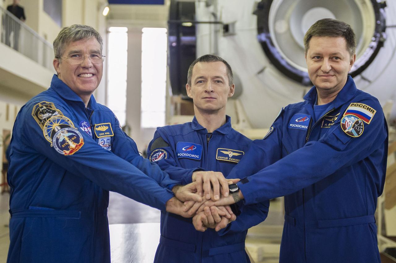 jsc2020e016222 - At the Gagarin Cosmonaut Training Center in Star City, Russia, Expedition 63 backup crewmembers Steve Bowen of NASA (left) and Sergey Ryzhikov (center) and Andrei Babkin (right) of Roscosmos pose for pictures March 12 during the second day of Soyuz qualification exams. They are the backups to Chris Cassidy of NASA and Anatoly Ivanishin and Ivan Vagner of Roscosmos who are scheduled to launch April 9 on the Soyuz MS-16 spacecraft from the Baikonur Cosmodrome in Kazakhstan for a six-and-a-half month mission on the International Space Station...Andrey Shelepin/Gagarin Cosmonaut Training Center.