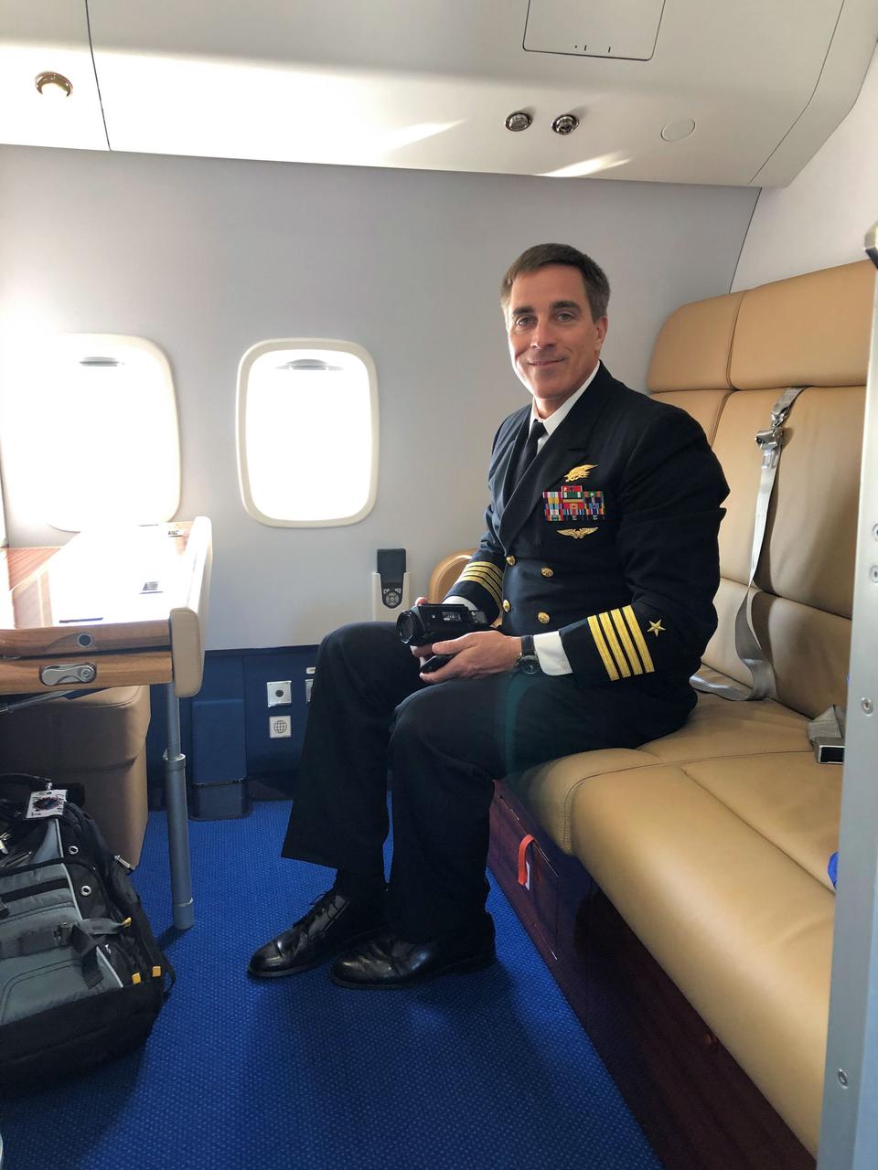 jsc2020e016837 - Aboard a Gagarin Cosmonaut Training Center aircraft, NASA astronaut Chris Cassidy poses for pictures March 24 as he heads for his launch site at the Baikonur Cosmodrome in Kazakhstan with his crewmates. Cassidy and Anatoly Ivanishin and Ivan Vagner of Roscosmos will launch April 9 on the Soyuz MS-16 spacecraft from the Baikonur Cosmodrome for a six-and-a-half month mission on the International Space Station...Dr. Josef Schmid/NASA.