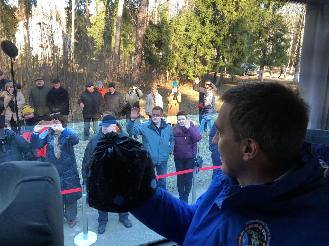 jsc2020e016838 - At the Gagarin Cosmonaut Training Center in Star City, Russia, NASA astronaut Chris Cassidy waves to well-wishers March 24 as he departs with his crewmates for their launch site at the Baikonur Cosmodrome in Kazakhstan. Cassidy and Anatoly Ivanishin and Ivan Vagner of Roscosmos will launch April 9 on the Soyuz MS-16 spacecraft from the Baikonur Cosmodrome for a six-and-a-half month mission on the International Space Station...Dr. Josef Schmid/NASA.