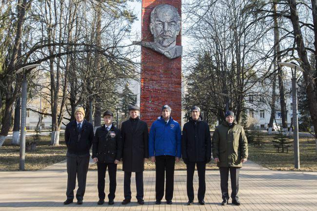 jsc2020e016840 - At the Gagarin Cosmonaut Training Center in Star City, Russia, the Expedition 63 backup and prime crewmembers pose for pictures March 24 in front of the statue of Vladimir Lenin prior to their departure for their launch site at the Baikonur Cosmodrome in Kazakhstan. From left to right are backup crewmembers Steve Bowen of NASA and Sergey Ryzhikov and Andrei Babkin of Roscosmos and prime crewmembers Chris Cassidy of NASA and Anatoly Ivanishin and Ivan Vagner of Roscosmos. Cassidy, Ivanishin and Vagner will launch April 9 on the Soyuz MS-16 spacecraft from the Baikonur Cosmodrome in Kazakhstan for a six-and-a-half month mission on the International Space Station...Irina Spector/Gagarin Cosmonaut Training Center.