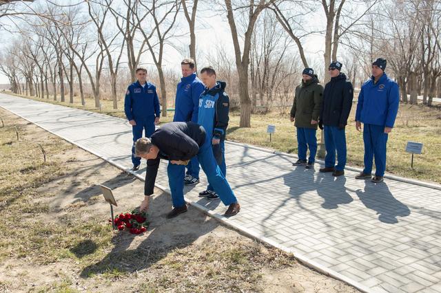 jsc2020e016870 - Along the Walk of the Cosmonauts at the Cosmonaut Hotel crew quarters in Baikonur, Kazakhstan, Expedition 63 backup crewmember Steve Bowen of NASA lays flowers March 27 at the site where the tree bearing the name of Yuri Gagarin, the first human to fly in space, is planted. March 27, 2020 marked the 52nd anniversary of Gagarin’s death at the age of 34. Looking on are cosmonaut Yuri Malenchenko, the Deputy Director of the Gagarin Cosmonaut Training Center, and backup crewmates Andrei Babkin and Sergey Ryzhikov of Roscosmos. Looking on at the right are prime crewmembers Chris Cassidy of NASA and Ivan Vagner and Anatoly Ivanishin of Roscosmos who will launch April 9 on the Soyuz MS-16 spacecraft from the Baikonur Cosmodrome in Kazakhstan for a six-and-a-half month mission on the International Space Station...Andrey Shelepin/Gagarin Cosmonaut Training Center.