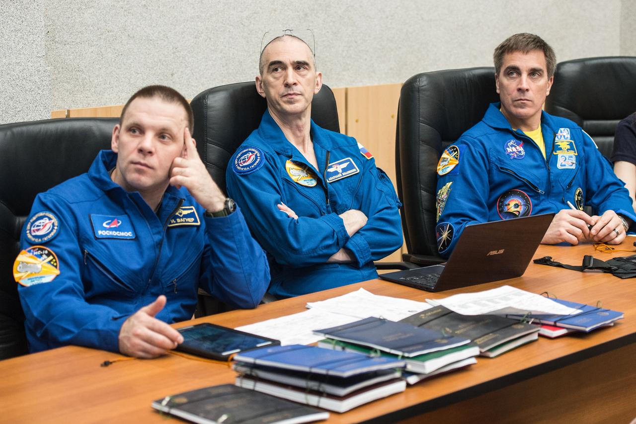 jsc2020e016956 - At the Cosmonaut Hotel crew quarters in Baikonur, Kazakhstan, Expedition 63 crewmembers Ivan Vagner (left) and Anatoly Ivanishin (center) of Roscosmos and Chris Cassidy of NASA (right) review launch procedures April 1. They will launch April 9 on the Soyuz MS-16 spacecraft from the Baikonur Cosmodrome in Kazakhstan for a six-and-a-half month mission on the International Space Station...Andrey Shelepin/Gagarin Cosmonaut Training Center.