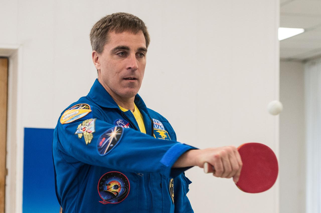 jsc2020e016965 - At the Cosmonaut Hotel crew quarters in Baikonur, Kazakhstan, Expedition 63 crewmember Chris Cassidy of NASA plays a game of ping-pong April 1. Cassidy and Ivan Vagner and Anatoly Ivanishin of Roscosmos will launch April 9 on the Soyuz MS-16 spacecraft from the Baikonur Cosmodrome in Kazakhstan for a six-and-a-half month mission on the International Space Station...Andrey Shelepin/Gagarin Cosmonaut Training Center.