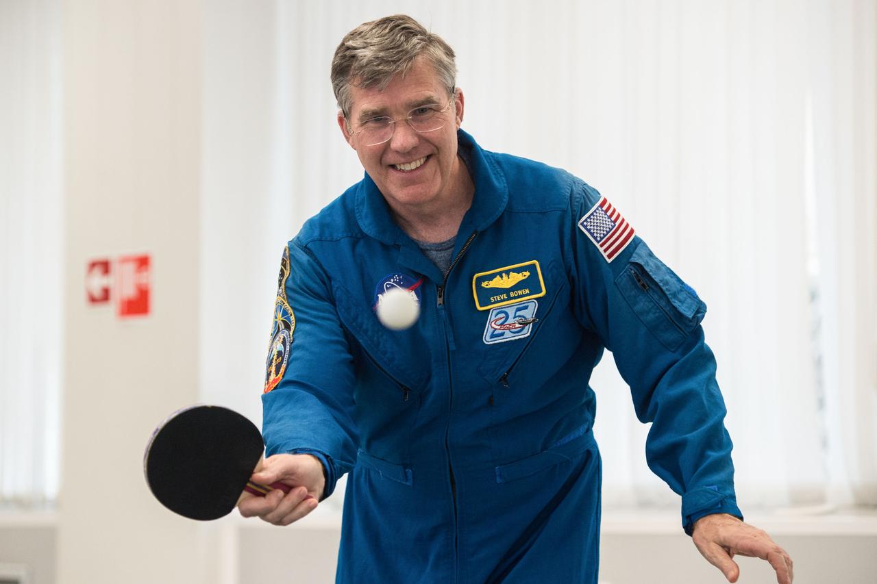 jsc2020e016966 - At the Cosmonaut Hotel crew quarters in Baikonur, Kazakhstan, Expedition 63 backup crewmember Steve Bowen of NASA plays a game of ping-pong April 1 as he takes a break from pre-launch training. Bowen and Sergey Ryzhikov and Andrei Babkin of Roscosmos are the backups to the prime crew, Chris Cassidy of NASA and Anatoly Ivanishin and Ivan Vagner of Roscosmos, who will launch April 9 on the Soyuz MS-16 spacecraft from the Baikonur Cosmodrome in Kazakhstan for a six-and-a-half month mission on the International Space Station...Andrey Shelepin/Gagarin Cosmonaut Training Center.