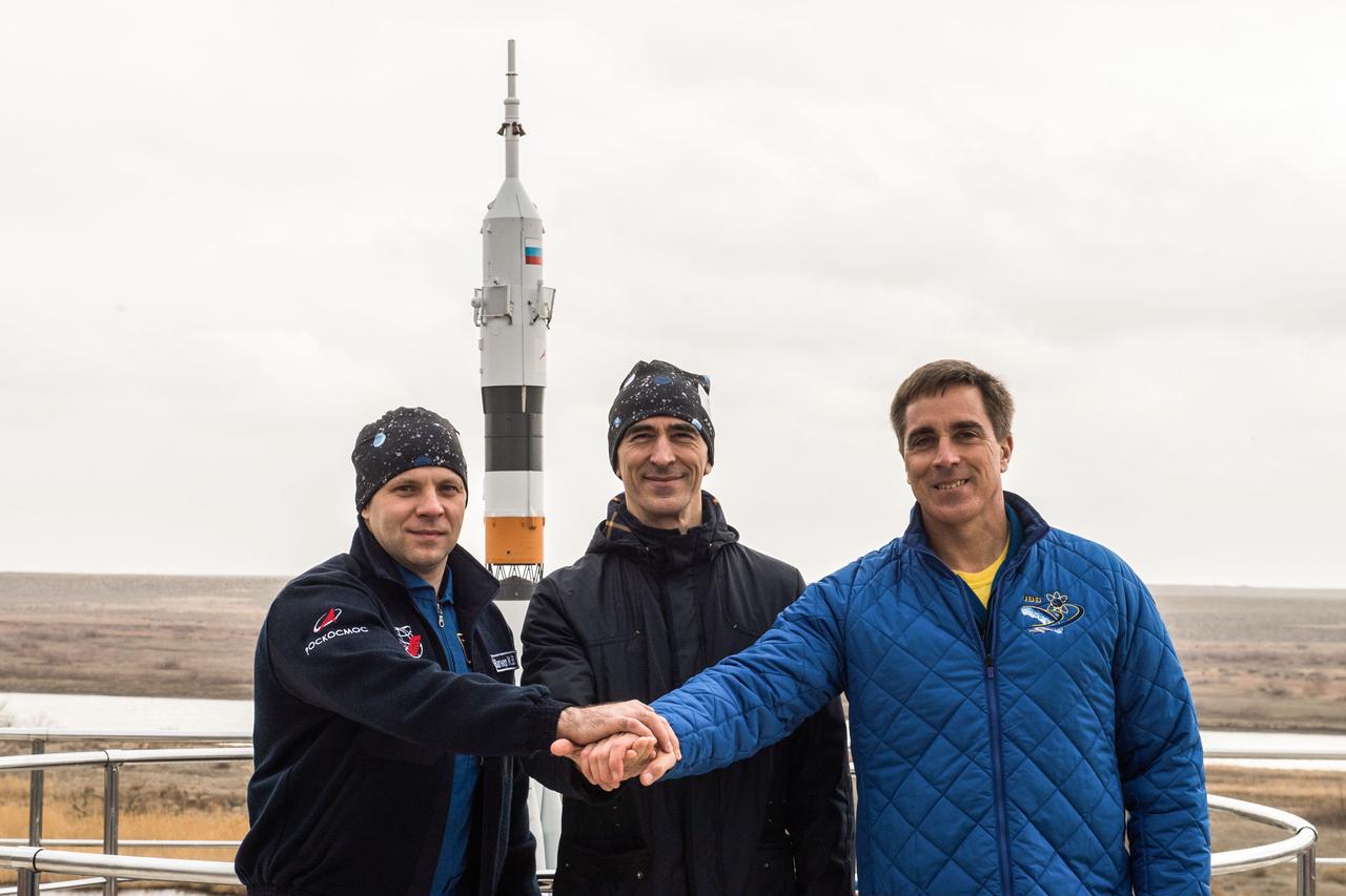 jsc2020e016975 - At the Cosmonaut Hotel crew quarters in Baikonur, Kazakhstan, Expedition 63 crewmembers Ivan Vagner (left) and Anatoly Ivanishin (center) of Roscosmos and Chris Cassidy of NASA (right) pose for pictures April 1 during pre-launch training. They will launch April 9 on the Soyuz MS-16 spacecraft from the Baikonur Cosmodrome in Kazakhstan for a six-and-a-half month mission on the International Space Station...Andrey Shelepin/Gagarin Cosmonaut Training Center.