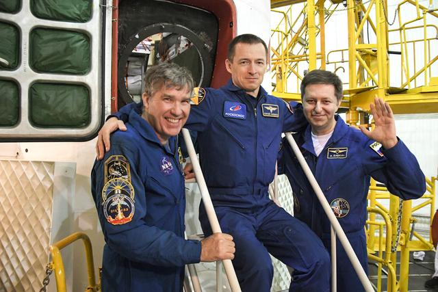 jsc2020e016984 - At the Baikonur Cosmodrome in Kazakhstan, Expedition 63 backup crewmembers Steve Bowen of NASA (left) and Sergey Ryzhikov (center) and Andrei Babkin (right) of Roscosmos pose for pictures April 3 in front of the Soyuz MS-16 spacecraft as part of pre-launch activities. They are the backups to the prime crew, Chris Cassidy of NASA and Anatoly Ivanishin and Ivan Vagner of Roscosmos, who will launch April 9 on the Soyuz MS-16 spacecraft from Baikonur on April 9 for a six-and-a-half month mission on the International Space Station...Courtesy/Roscosmos.