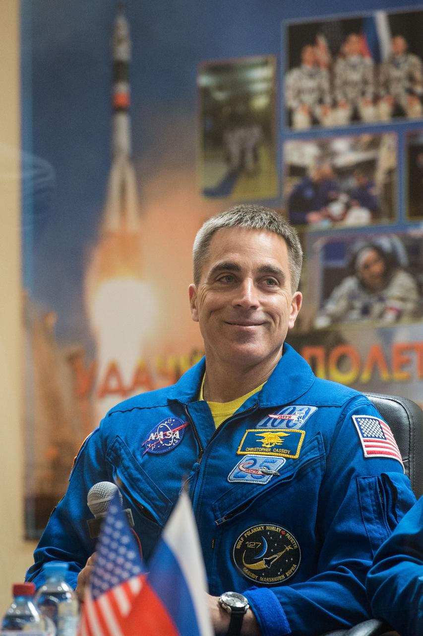 jsc2020e017040 - At the Cosmonaut Hotel crew quarters in Baikonur, Kazakhstan, Expedition 63 crewmember Chris Cassidy of NASA smiles as he responds to questions provided by reporters in a virtual question and answer session April 8 as he prepares for launch. Cassidy and Anatoly Ivanishin and Ivan Vagner of Roscosmos will launch April 9 on the Soyuz MS-16 spacecraft from the Baikonur Cosmodrome for a six-and-a-half month mission on the International Space Station...Andrey Shelepin/Gagarin Cosmonaut Training Center.