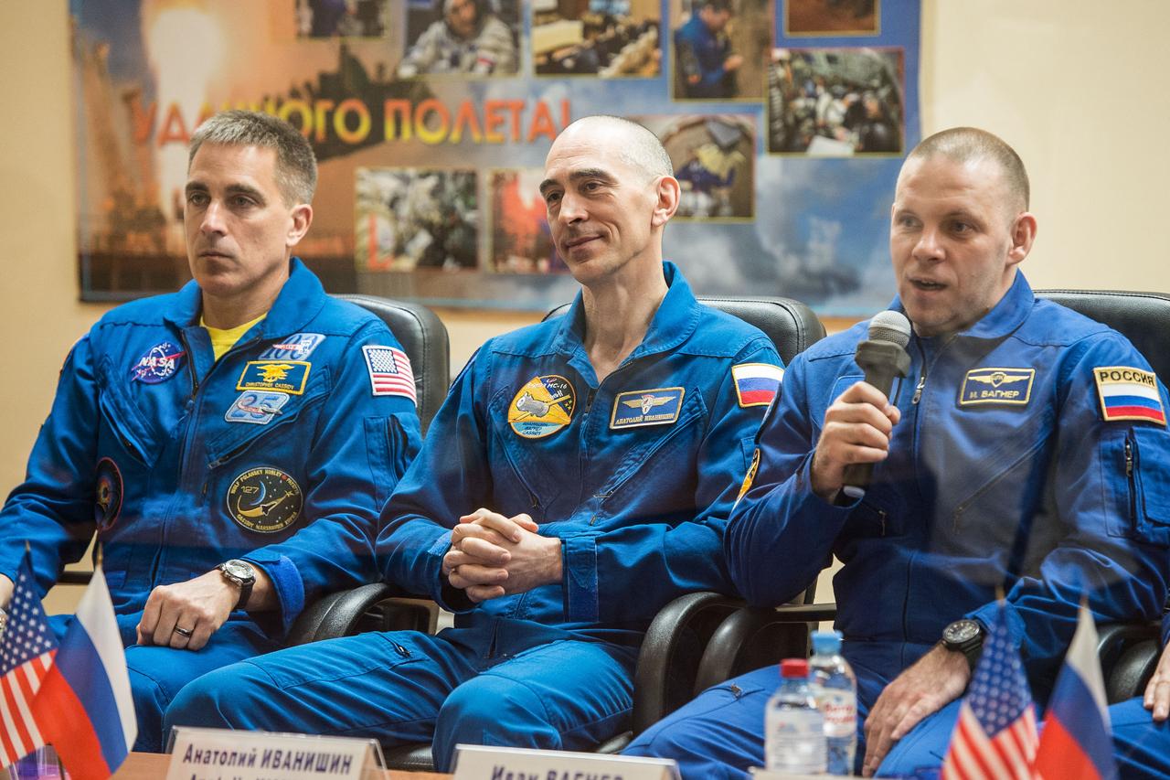 jsc2020e017045 - At the Cosmonaut Hotel crew quarters in Baikonur, Kazakhstan, Expedition 63 crewmember Ivan Vagner of Roscosmos (right) responds to questions provided by reporters in a virtual question and answer session April 8 as he prepares for launch. Vagner and Anatoly Ivanishin (center) of Roscosmos and Chris Cassidy (left) of NASA will launch April 9 on the Soyuz MS-16 spacecraft from the Baikonur Cosmodrome for a six-and-a-half month mission on the International Space Station...Andrey Shelepin/Gagarin Cosmonaut Training Center.