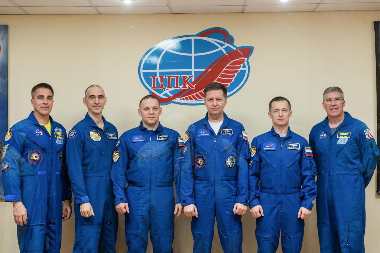 jsc2020e017046 - At the Cosmonaut Hotel crew quarters in Baikonur, Kazakhstan, the Expedition 63 prime and backup crewmembers pose for pictures April 8 as they prepare for launch. From left to right are prime crewmembers Chris Cassidy of NASA and Anatoly Ivanishin and Ivan Vagner of Roscosmos and backup crewmembers Andrei Babkin and Sergey Ryzhikov of Roscosmos and Steve Bowen of NASA. Cassidy, Ivanishin and Vagner will launch April 9 on the Soyuz MS-16 spacecraft from the Baikonur Cosmodrome for a six-and-a-half month mission on the International Space Station...Andrey Shelepin/Gagarin Cosmonaut Training Center.