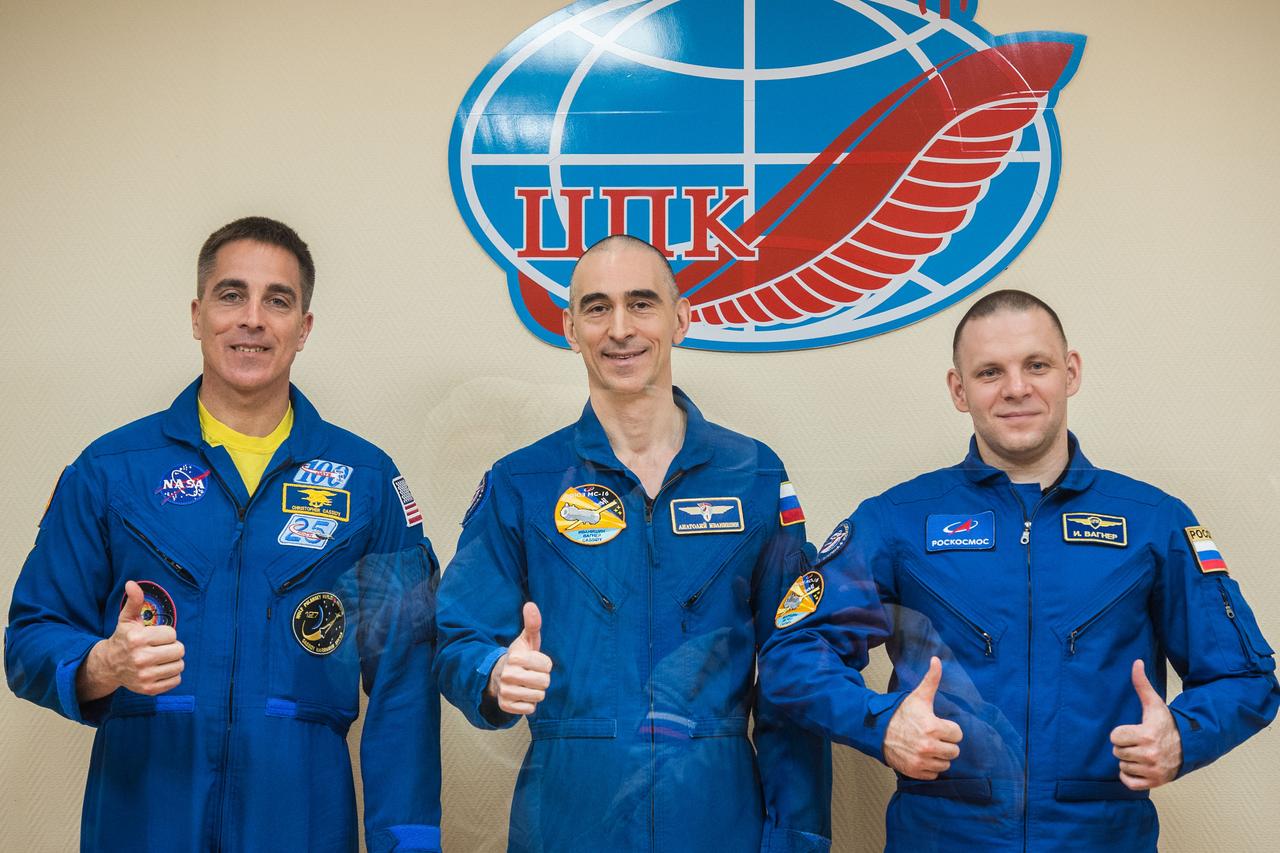 jsc2020e017049 - At the Cosmonaut Hotel crew quarters in Baikonur, Kazakhstan, Expedition 63 crewmembers Chris Cassidy of NASA (left) and Anatoly Ivanishin (center) and Ivan Vagner (right) of Roscosmos pose for pictures April 8 as they prepare for launch. They will launch April 9 on the Soyuz MS-16 spacecraft from the Baikonur Cosmodrome for a six-and-a-half month mission on the International Space Station...Andrey Shelepin/Gagarin Cosmonaut Training Center.