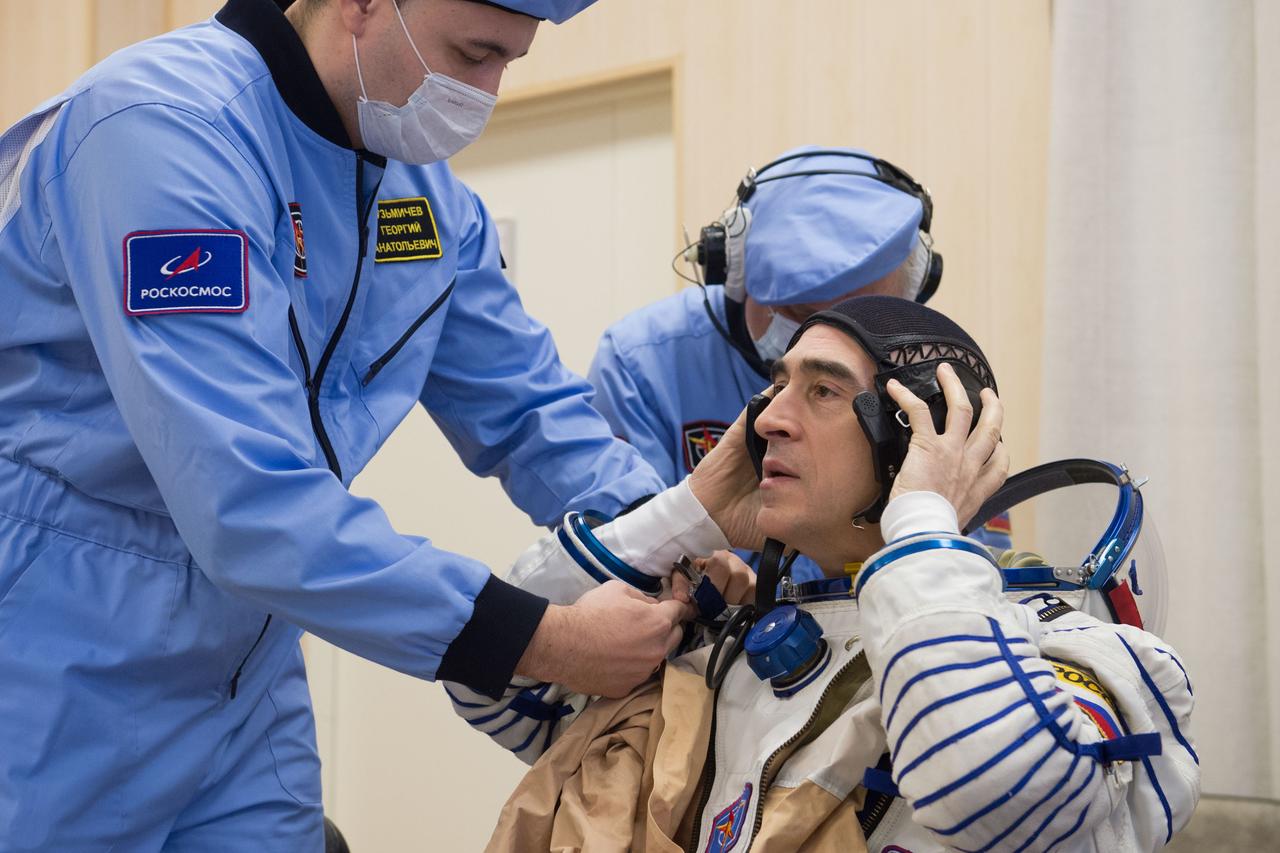 jsc2020e017069 - Expedition 63 Preflight - Expedition 63 crewmember Anatoly Ivanishin of Roscosmos dons his Sokol suit a few hours ahead of his launch on a Soyuz rocket with Ivan Vagner of Roscosmos, and Chris Cassidy of NASA, Thursday, April 9, 2020 at the Baikonur Cosmodrome in Kazakhstan. A few hours later, they lifted off for a six-and-a-half month mission on the International Space Station. Photo Credit: (NASA/GCTC/Andrey Shelepin)
