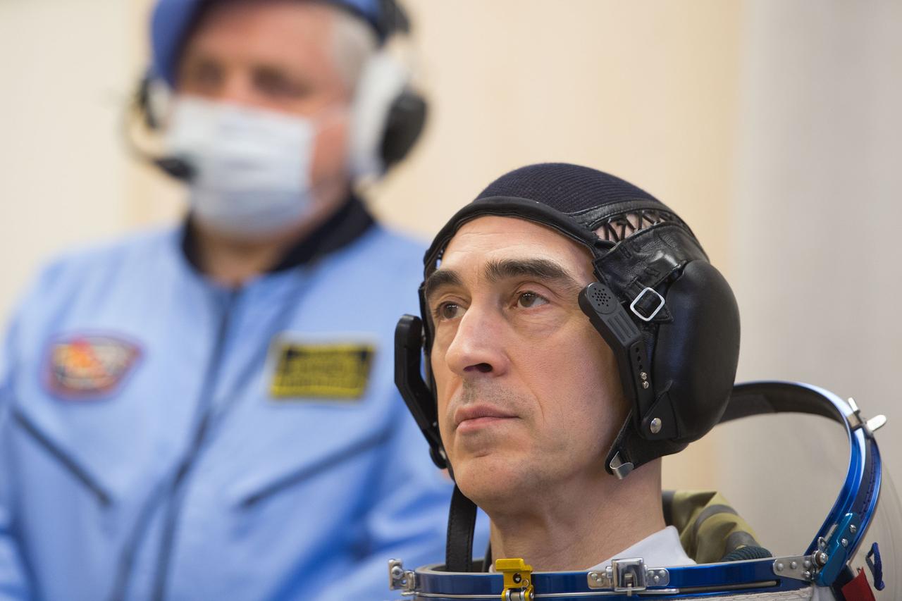 jsc2020e017070 - Expedition 63 Preflight - Expedition 63 crewmember Anatoly Ivanishin of Roscosmos dons his Sokol suit a few hours ahead of his launch on a Soyuz rocket with Ivan Vagner of Roscosmos, and Chris Cassidy of NASA, Thursday, April 9, 2020 at the Baikonur Cosmodrome in Kazakhstan. A few hours later, they lifted off for a six-and-a-half month mission on the International Space Station. Photo Credit: (NASA/GCTC/Andrey Shelepin)