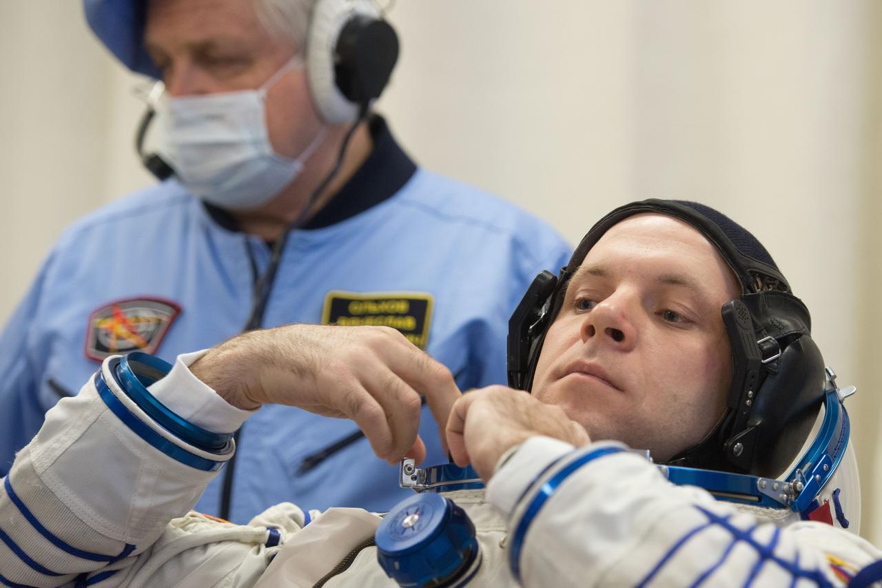 jsc2020e017071 - Expedition 63 Preflight - Expedition 63 crewmember Ivan Vagner of Roscosmos dons his Sokol suit a few hours ahead of his launch on a Soyuz rocket with Anatoly Ivanishin of Roscosmos, and Chris Cassidy of NASA, Thursday, April 9, 2020 at the Baikonur Cosmodrome in Kazakhstan. A few hours later, they lifted off for a six-and-a-half month mission on the International Space Station. Photo Credit: (NASA/GCTC/Andrey Shelepin)