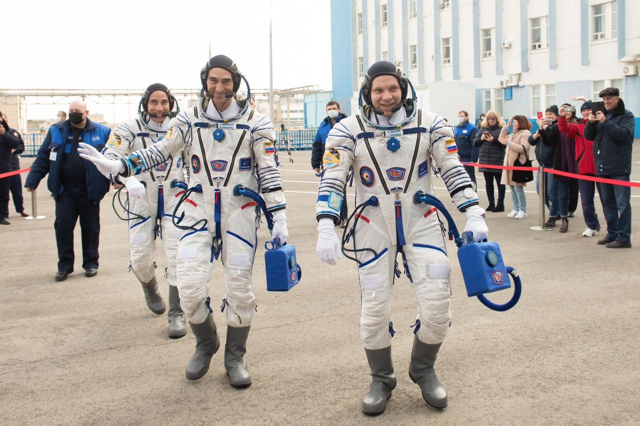 jsc2020e017108 - Expedition 63 Preflight - Expedition 63 crewmembers Chris Cassidy of NASA, left, Anatoly Ivanishin, center, and Ivan Vagner of Roscosmos, depart building 254 for the launch pad, Thursday, April 9, 2020 at the Baikonur Cosmodrome in Kazakhstan. A few hours later, they lifted off on a Soyuz rocket for a six-and-a-half month mission on the International Space Station. Photo Credit: (NASA/GCTC/Andrey Shelepin)...
