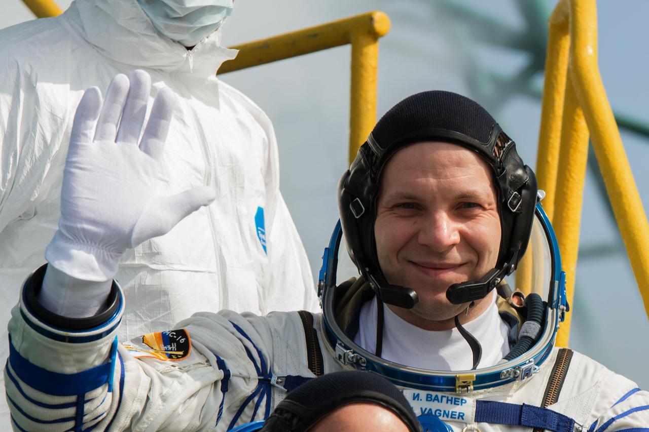 jsc2020e017123 - Expedition 63 Crew Waves Farewell - Expedition 63 crewmember Ivan Vagner of Roscosmos waves goodbye as he, Chris Cassidy of NASA, and Anatoly Ivanishin of Roscosmos, prepare to climb aboard the Soyuz MS-16 rocket at Site 31 at the Baikonur Cosmodrome in Kazakhstan, Thursday, April 9, 2020. They launched a short time later to the International Space Station for the start of a six-and-a-half month mission. Photo Credit: (NASA/GCTC/Andrey Shelepin)