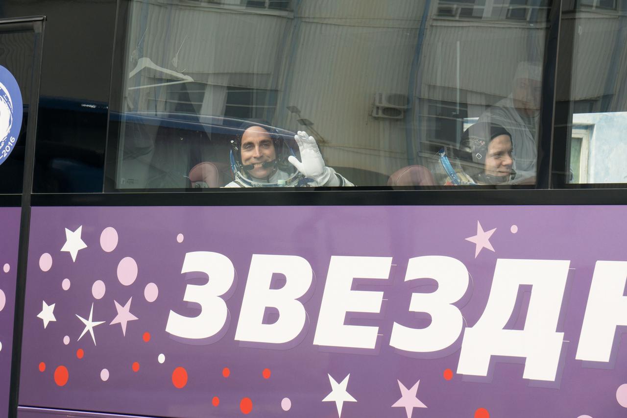 jsc2020e017129 - Expedition 63 Preflight - Expedition 63 crewmember Chris Cassidy of NASA, left, waves farewell as he, Anatoly Ivanishin and Ivan Vagner of Roscosmos depart for the launch pad, Thursday, April 9, 2020 at the Baikonur Cosmodrome in Kazakhstan. A few hours later, they lifted off on a Soyuz rocket for a six-and-a-half month mission on the International Space Station. Photo Credit: (NASA/Victor Zelentsov)...