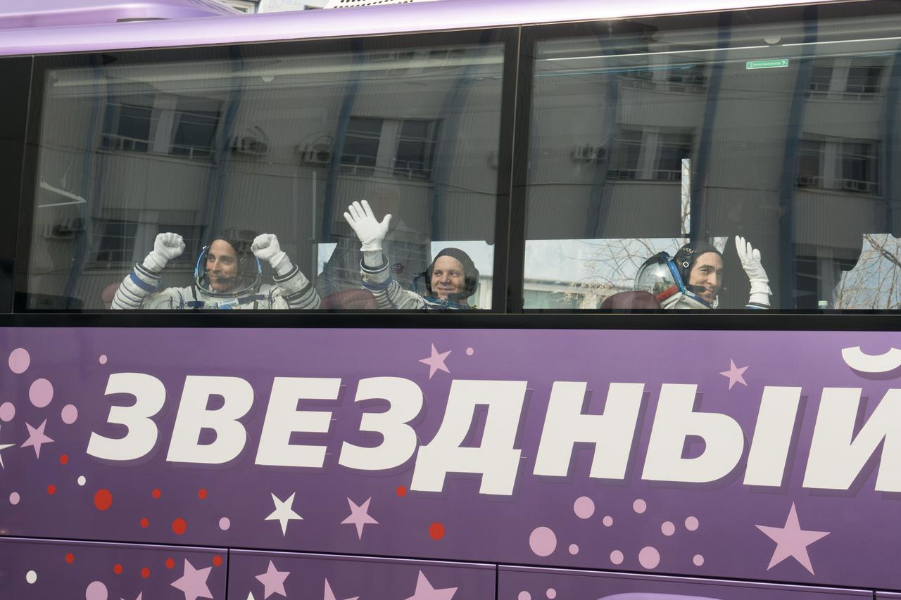 jsc2020e017130 - Expedition 63 Preflight - Expedition 63 crewmembers Chris Cassidy of NASA, left, Ivan Vagner and Anatoly Ivanishin of Roscosmos wave farewell as they depart for the launch pad, Thursday, April 9, 2020 at the Baikonur Cosmodrome in Kazakhstan. A few hours later, they lifted off on a Soyuz rocket for a six-and-a-half month mission on the International Space Station. Photo Credit: (NASA/Victor Zelentsov)...