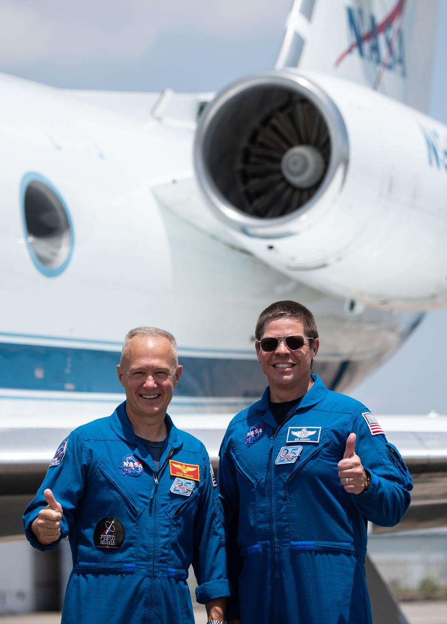 Date: 05-20-2020 Location: Ellington Field - Hangar 276 Tarmac Subject: At Ellington Field near NASA’s Johnson Space Center in Houston, astronauts Douglas Hurley(left) and Robert Behnken pose for a photo before boarding the Gulfstream jet that will carry them to the agency’s Kennedy Space Center in Florida on May 20, 2020, in preparation for NASA’s SpaceX Demo-2 mission. Under NASA’s Commercial Crew Program, Behnken and Hurley will be the first astronauts to launch to the International Space Station from U.S. soil since the end of the Space Shuttle Program in 2011. Liftoff of the SpaceX Falcon 9 rocket and Crew Dragon spacecraft is scheduled for 4:33 p.m. on May 27 from Kennedy’s Launch Complex 39A.
