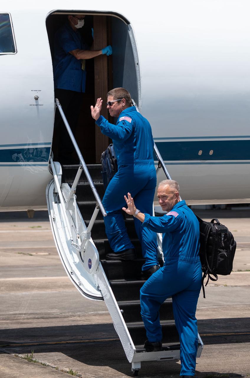Date: 05-20-2020 Location: Ellington Field - Hangar 276 Tarmac Subject: At Ellington Field near NASA’s Johnson Space Center in Houston, astronauts Robert Behnken(left) and Douglas Hurley board the Gulfstream jet that will carry them to the agency’s Kennedy Space Center in Florida on May 20, 2020, in preparation for NASA’s SpaceX Demo-2 mission. Under NASA’s Commercial Crew Program, Behnken and Hurley will be the first astronauts to launch to the International Space Station from U.S. soil since the end of the Space Shuttle Program in 2011. Liftoff of the SpaceX Falcon 9 rocket and Crew Dragon spacecraft is scheduled for 4:33 p.m. on May 27 from Kennedy’s Launch Complex 39A.