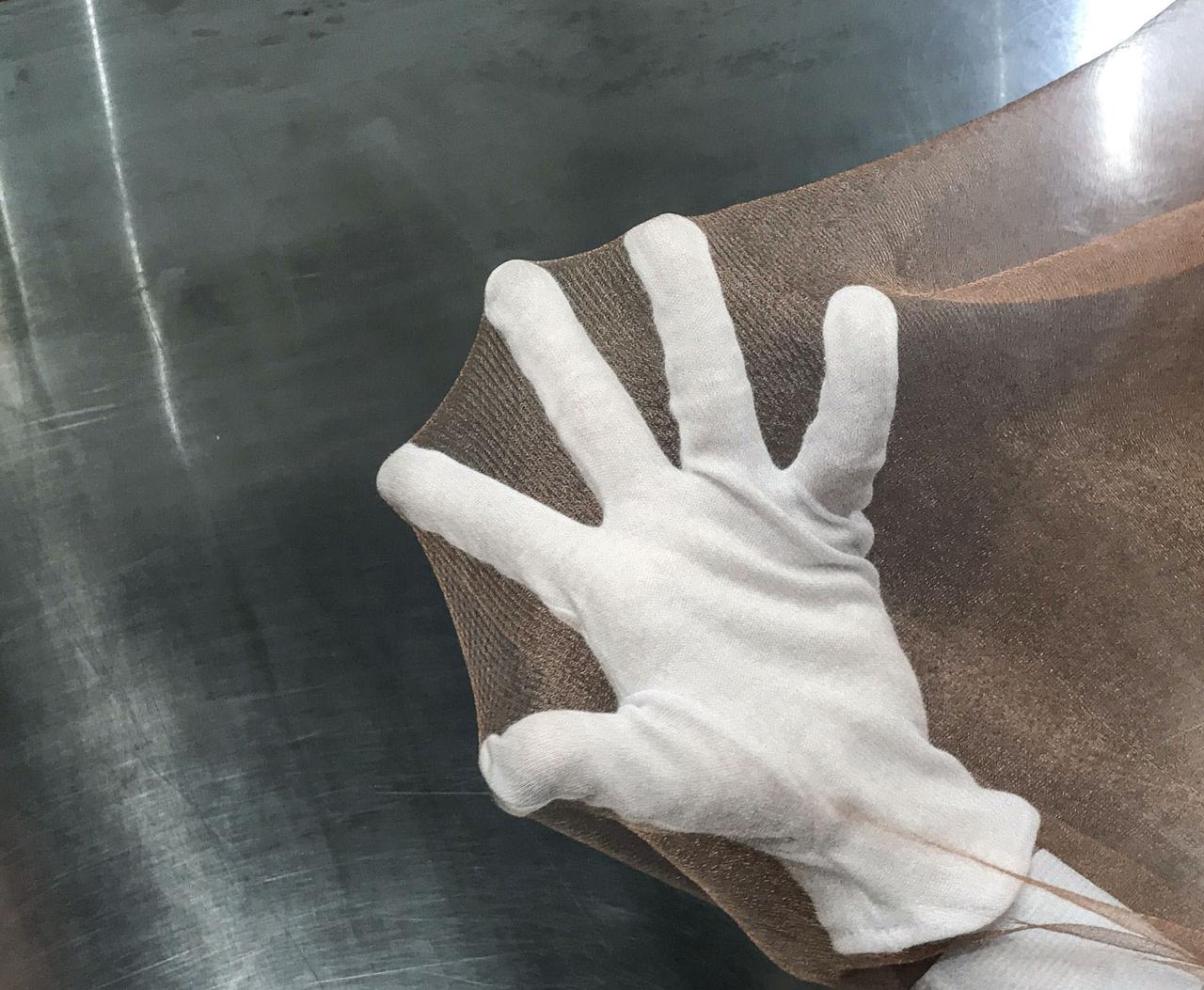 jsc2020e040945 (7/10/2020) ---  Copper zirconium antenna metal mesh. The Exposure Experiment of Copper-Zirconium Antenna Metal Mesh to the Space Environment (ExHAM-Antenna Metal Mesh) investigation tests how well an antenna metal mesh, made from copper and zirconium, performs in the space environment in low-Earth orbit (LEO). While in space, the antenna metal mesh is exposed to cosmic rays and atomic oxygen in the LEO space environment - which can degrade antenna performance. Image Credit: NGK Insulators, Ltd., Taiyo Wire Cloth Co., Ltd., Technosolver Corporation, Koyo Materica Corporation, JAXA..