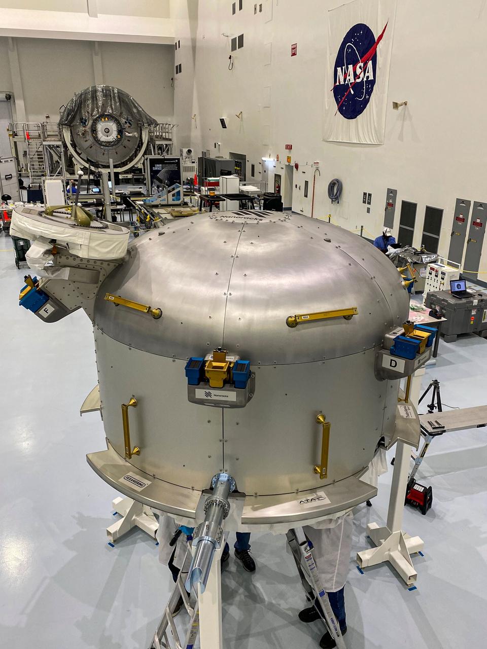 jsc2020e044491 (10/5/2020) —- A preflight view of the Nanoracks Airlock. The Nanoracks Bishop Airlock (Nanoracks Airlock) is the first-ever commercially owned and operated airlock on the International Space Station. It provides a variety of capabilities including jettisoning of payloads such as Cubesats, deployment of external payloads, support for small exterior payloads and locker-sized internal payloads, recovery of external on-orbit replaceable units (ORUs), and the ability to move hardware outside in support of extravehicular activities (EVAs). It is approximately five times larger than the Japanense Experiment Module (JEM) Airlock so it can accommodate more and larger payloads. The Airlock’s capabilities support many different types of scientific investigations.