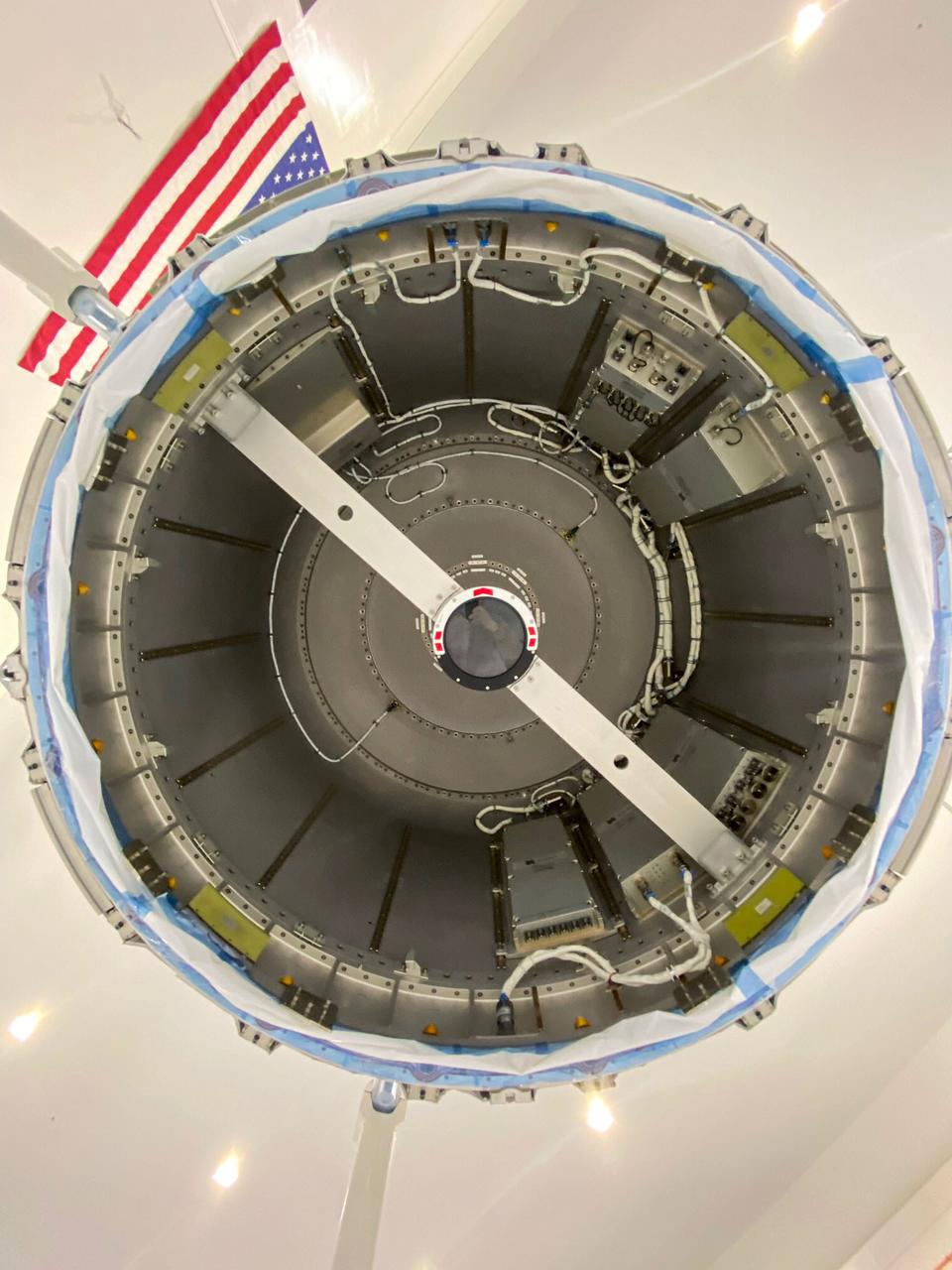 jsc2020e044492 (10/6/2020) —- A preflight view of the Nanoracks Airlock. The Nanoracks Bishop Airlock (Nanoracks Airlock) is the first-ever commercially owned and operated airlock on the International Space Station. It provides a variety of capabilities including jettisoning of payloads such as Cubesats, deployment of external payloads, support for small exterior payloads and locker-sized internal payloads, recovery of external on-orbit replaceable units (ORUs), and the ability to move hardware outside in support of extravehicular activities (EVAs). It is approximately five times larger than the Japanense Experiment Module (JEM) Airlock so it can accommodate more and larger payloads. The Airlock’s capabilities support many different types of scientific investigations.