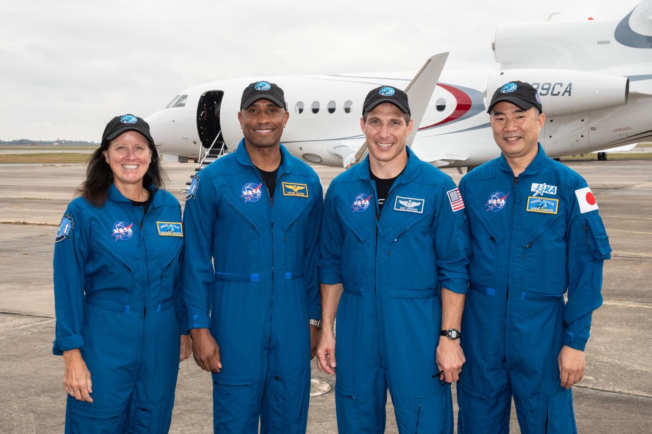 From left, NASA astronauts Shannon Walker, Victor Gover and Michael Hopkins, along with Soichi Noguchi of the Japan Aerospace Exploration Agency (JAXA), board a plane from Ellington Field near the agency’s Johnson Space Center in Houston, Texas, en route to Kennedy Space Center in Florida for NASA’s SpaceX Crew-1 mission to begin final launch preparations. Crew-1 is the first operational mission of the SpaceX Crew Dragon spacecraft and Falcon 9 rocket to the International Space Station as part of the agency’s Commercial Crew Program.