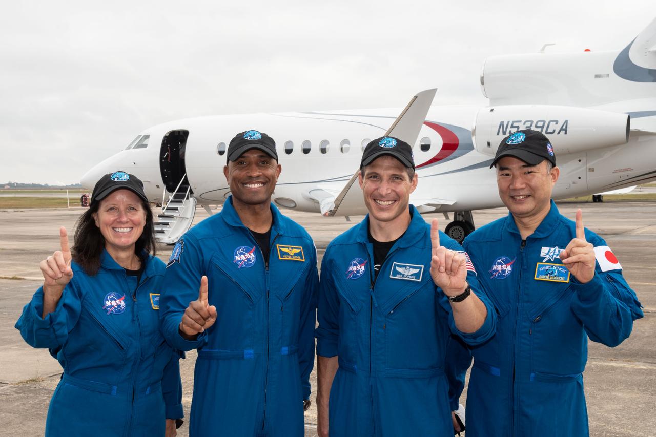 From left, NASA astronauts Shannon Walker, Victor Gover and Michael Hopkins, along with Soichi Noguchi of the Japan Aerospace Exploration Agency (JAXA), board a plane from Ellington Field near the agency’s Johnson Space Center in Houston, Texas, en route to Kennedy Space Center in Florida for NASA’s SpaceX Crew-1 mission to begin final launch preparations. Crew-1 is the first operational mission of the SpaceX Crew Dragon spacecraft and Falcon 9 rocket to the International Space Station as part of the agency’s Commercial Crew Program.