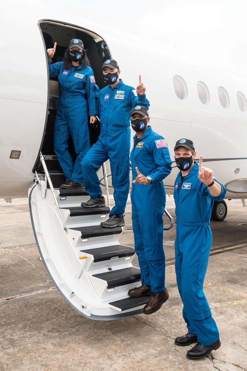 From left, NASA astronaut Shannon Walker, Soichi Noguchi of the Japan Aerospace Exploration Agency (JAXA), and NASA astronauts Victor Gover and Michael Hopkins, board a plane from Ellington Field near the agency’s Johnson Space Center in Houston, Texas, en route to Kennedy Space Center in Florida for NASA’s SpaceX Crew-1 mission to begin final launch preparations. Crew-1 is the first operational mission of the SpaceX Crew Dragon spacecraft and Falcon 9 rocket to the International Space Station as part of the agency’s Commercial Crew Program.