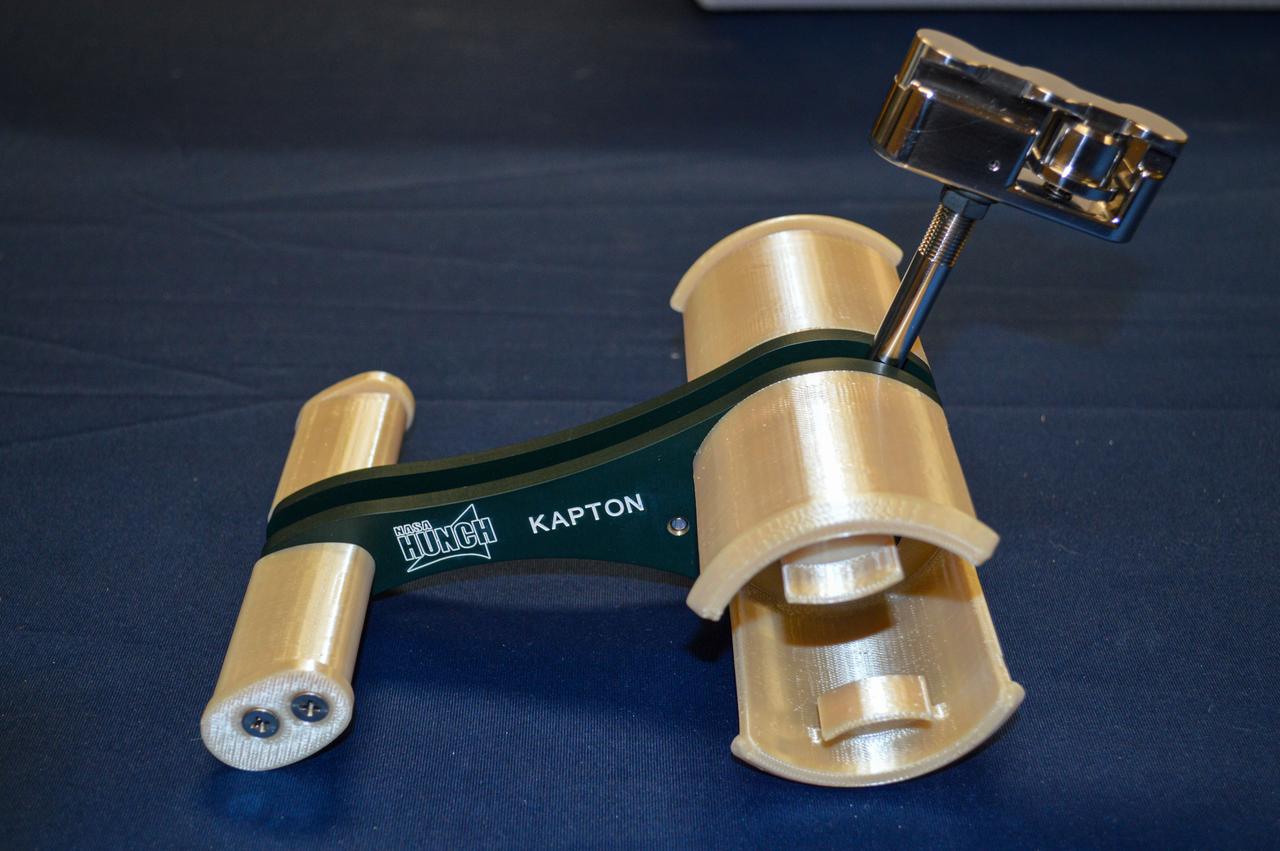 jsc2020e045036 (8/19/2020) --- Preflight bench review imagery of the High school students United with NASA to Create Hardware (HUNCH) Tape Dispenser (HUNCH Tape Dispenser). The dispenser enables one-handed operation for crew members. Crew members regularly use tape for mundane and critical tasks, but the tape must be cut with scissors, requiring two hands. The HUNCH Tape Dispenser is expected to improve efficiency of operations and scientific research on the space station.